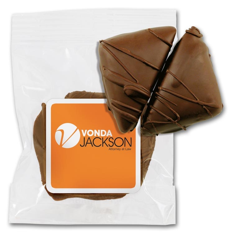 2 pieces of chocolate-covered caramels in a clear bag with your company logo.