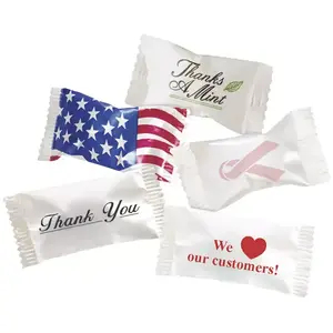 A variety of individually wrapped buttermints featuring different professional and holiday wrapper designs