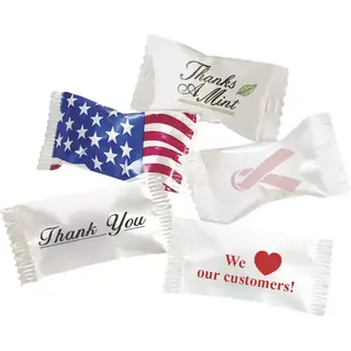 A variety of individually wrapped buttermints featuring different professional and holiday wrapper designs