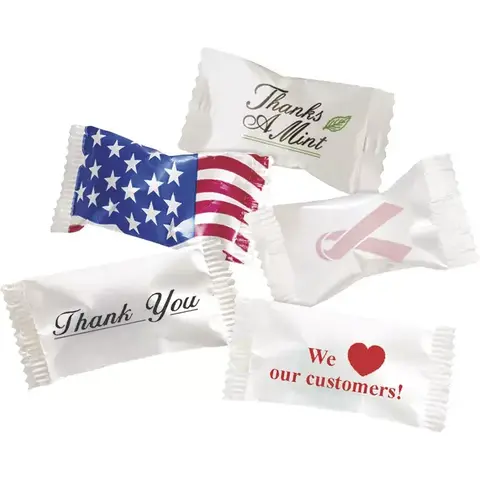 A variety of individually wrapped buttermints featuring different professional and holiday wrapper designs