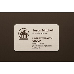 Custom linen business cards printed with a raised ink color on warm white paper