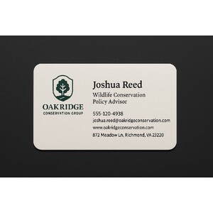 Thick off-white business card with rounded edges and a custom two-color print 