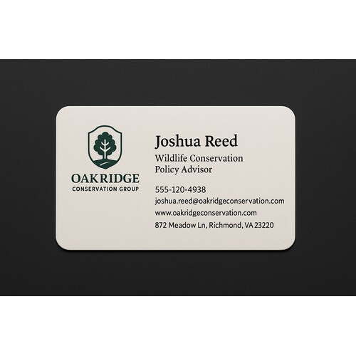 Thick off-white business card with rounded edges and a custom two-color print 