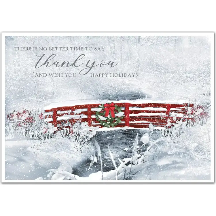 Business holiday card with a thankful greeting surrounded by snow and a red bridge