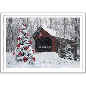 A custom printed business greeting card featuring a decorated outdoor Christmas tree 