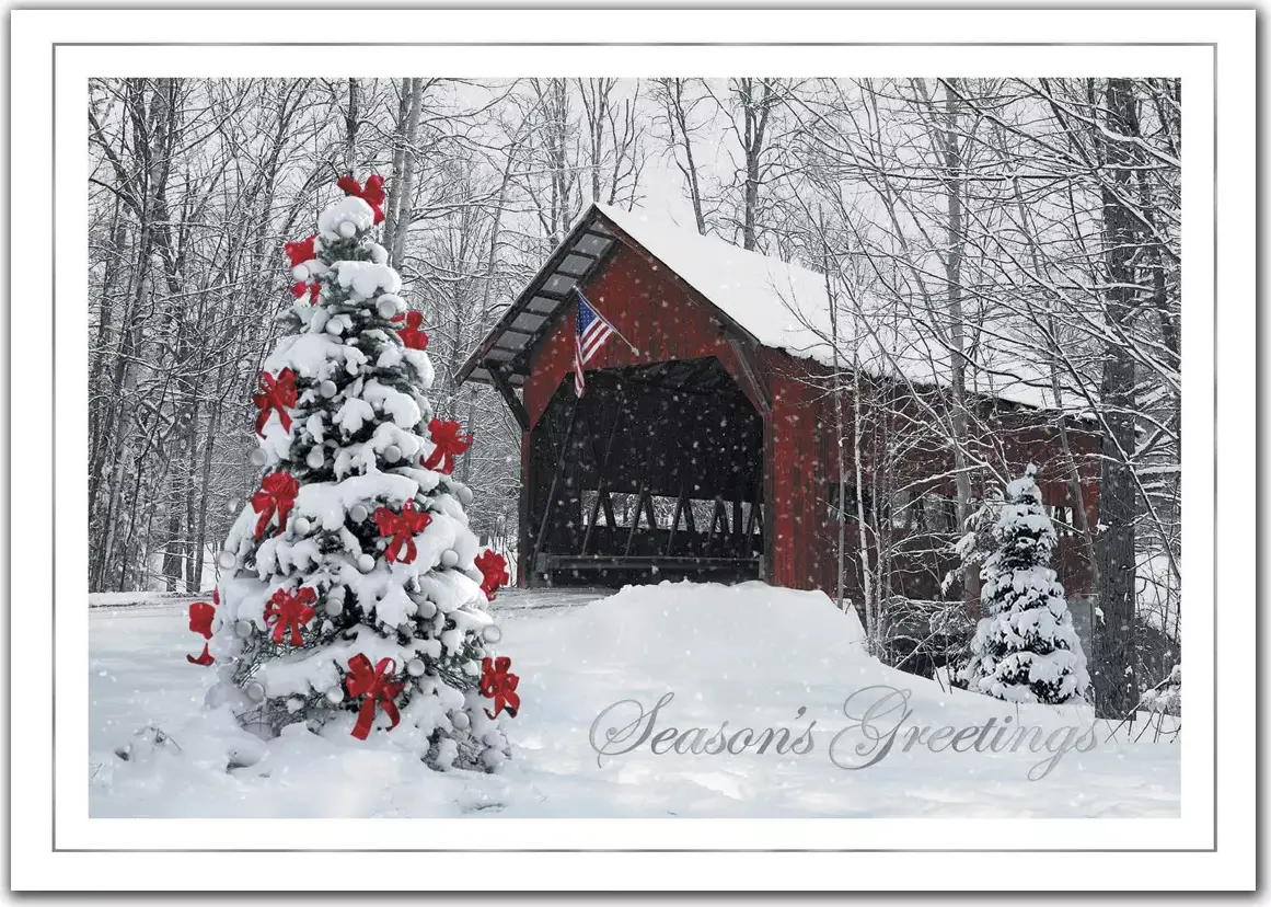 A custom printed business greeting card featuring a decorated outdoor Christmas tree 