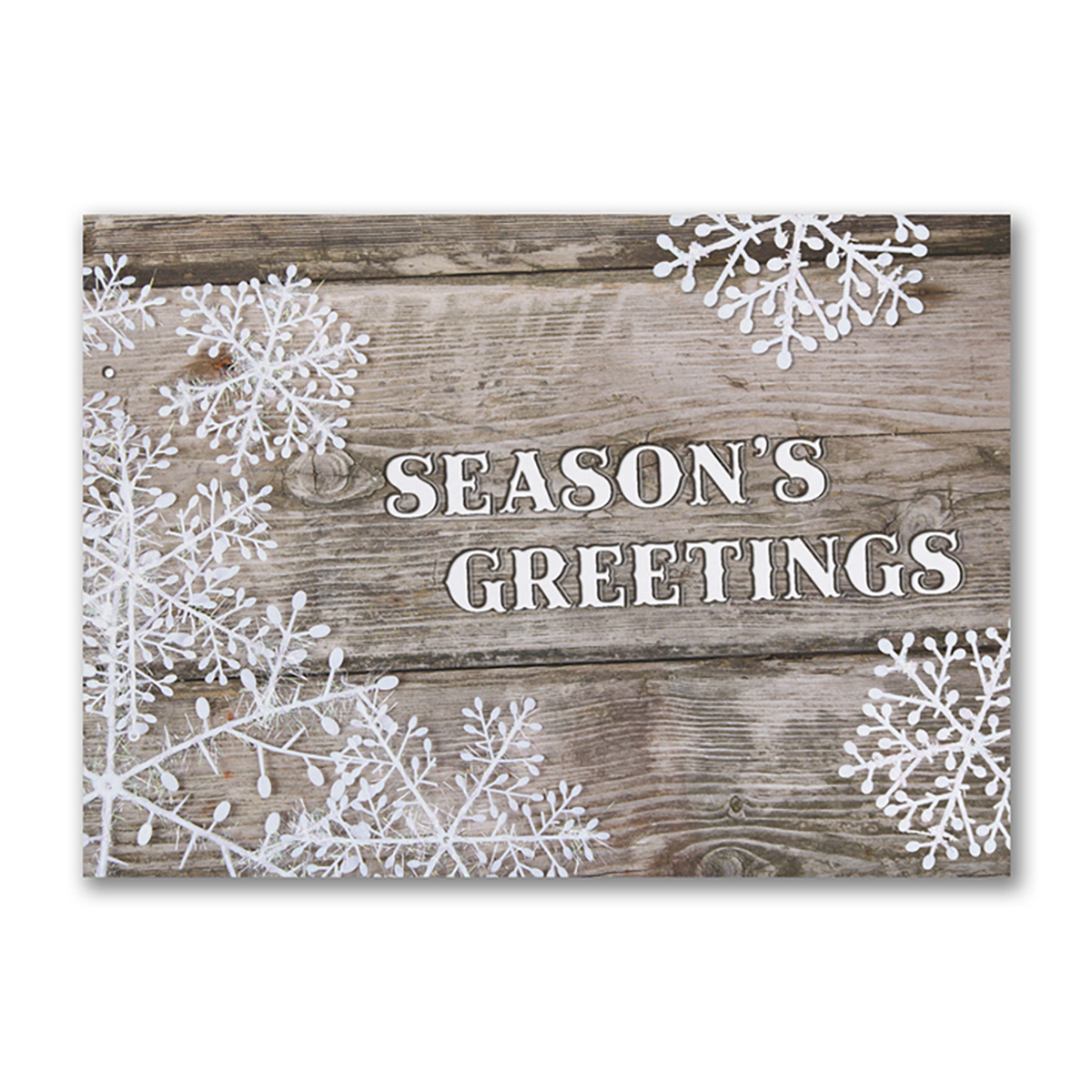 Rustic Season’s Greetings card with white snowflakes on a wooden background