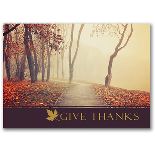 Thanksgiving card featuring a misty autumn park path with colorful fall leaves
