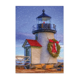 Holiday card featuring a coastal lighthouse decorated with a Christmas wreath and red bow in a snowy winter setting