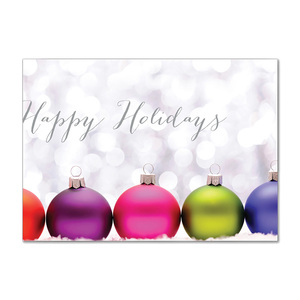Happy Holidays card featuring colorful Christmas ornaments against a soft sparkling background