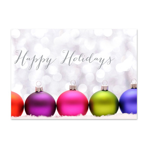 Happy Holidays card featuring colorful Christmas ornaments against a soft sparkling background