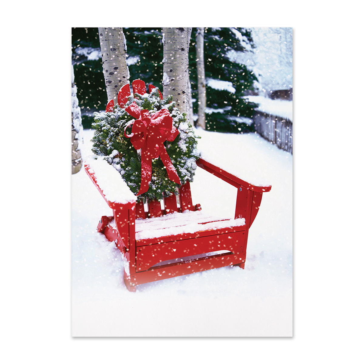 Festive winter holiday card featuring a red Adirondack chair adorned with a Christmas wreath and red bow in a snowy outdoor setting