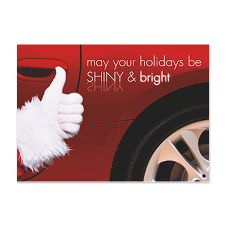 Custom automotive holiday card featuring a Santa thumbs-up beside a red car with the message "May Your Holidays Be Shiny & Bright"
