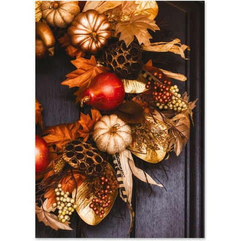 Elegant autumn harvest wreath featuring pumpkins, gourds, berries, and fall foliage on a dark wooden door