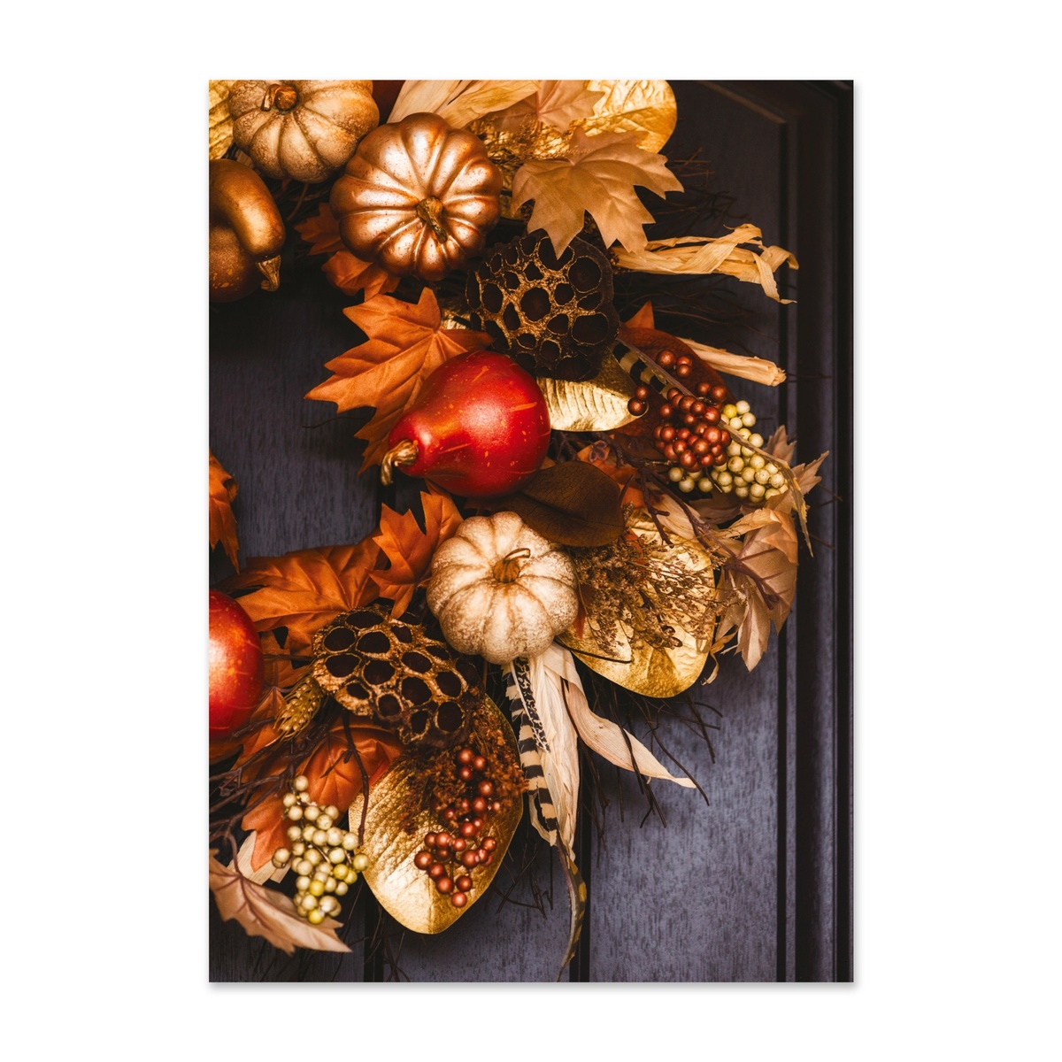 Elegant autumn harvest wreath featuring pumpkins, gourds, berries, and fall foliage on a dark wooden door