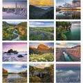 Open inside view of the Landscapes of America stapled wall calendar displaying monthly grid and scenic photography