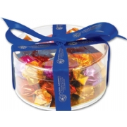 Clear gift box filled with Godiva chocolates and your business name on blue ribbon around it. Use as holiday gift.