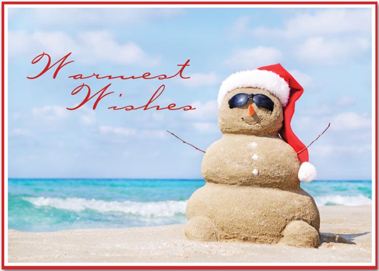 Holiday greeting card with a beach theme and sand Santa Claus