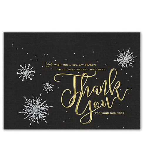 This elegant card on black stock with silver and gold foil snowflakes.